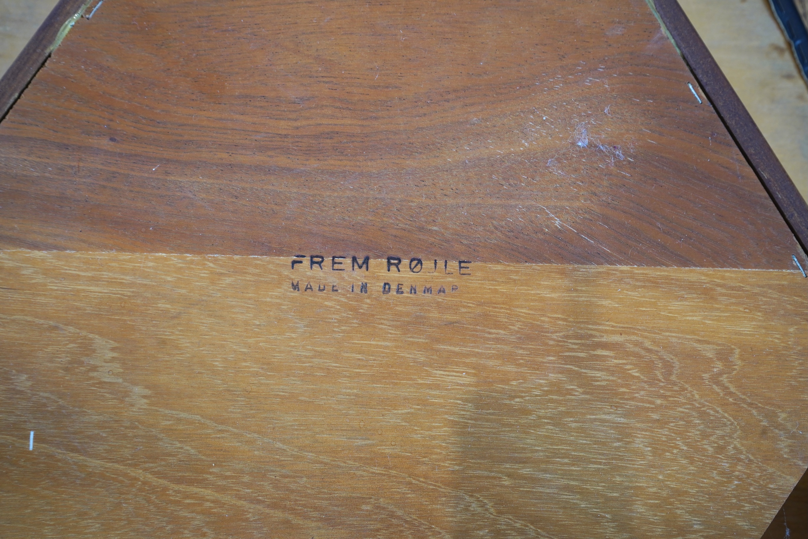 Hans Olsen (Danish, 1919–1992) for Frem Røjle: A Danish teak 'Roundette' extending dining table and four chairs